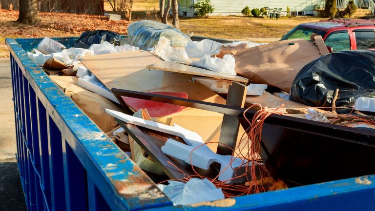 A roll off bin filled with garbage