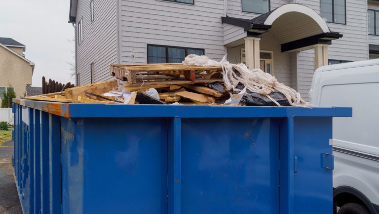 Dumpster filled with wooden debris, ready for disposal.